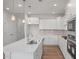 Gourmet kitchen boasts a large center island, stainless steel appliances, and ample countertop space at 3854 Well Fleet Drive, Fuquay Varina, NC 27526