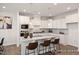 Modern kitchen featuring granite counters, stainless steel appliances, and pendant lighting at 3854 Well Fleet Drive, Fuquay Varina, NC 27526