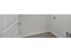 A laundry room with tile floors, utility hookups, and crisp white trim at 3854 Well Fleet Drive, Fuquay Varina, NC 27526
