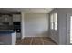 A bright room next to a kitchen featuring neutral walls and new windows, creating a versatile space at 3854 Well Fleet Drive, Fuquay Varina, NC 27526