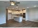 Open concept living space with kitchen, featuring stainless steel appliances and a kitchen island at 3854 Well Fleet Drive, Fuquay Varina, NC 27526