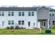 Backyard view of the home featuring white and gray siding, lawn, and a patio at 3860 Well Fleet Drive, Fuquay Varina, NC 27526