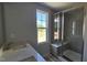 Contemporary bathroom boasting a double sink vanity and glass-enclosed shower at 3860 Well Fleet Drive, Fuquay Varina, NC 27526