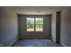 Serene bedroom with a large window and neutral tones creating a peaceful atmosphere at 3860 Well Fleet Drive, Fuquay Varina, NC 27526