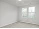 Bright bedroom with neutral carpet and natural light at 3860 Well Fleet Drive, Fuquay Varina, NC 27526
