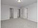 Spacious bedroom with neutral carpet and multiple doorways at 3860 Well Fleet Drive, Fuquay Varina, NC 27526