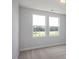 Bright, vacant bedroom featuring neutral carpet, large windows, and ample natural light at 3860 Well Fleet Drive, Fuquay Varina, NC 27526