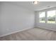 Spacious bedroom featuring neutral carpet, multiple windows and natural light at 3860 Well Fleet Drive, Fuquay Varina, NC 27526