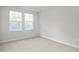 Bedroom boasting large windows providing ample natural light at 3860 Well Fleet Drive, Fuquay Varina, NC 27526