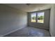 Bright bedroom with a cozy ambiance thanks to the natural light from large windows at 3860 Well Fleet Drive, Fuquay Varina, NC 27526
