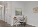 Versatile hallway area featuring desk, neutral paint, and plenty of natural light at 3860 Well Fleet Drive, Fuquay Varina, NC 27526