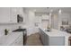 Modern kitchen featuring granite countertops, stainless steel appliances, and a central island at 3860 Well Fleet Drive, Fuquay Varina, NC 27526