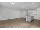Bright open-concept kitchen with an island and hardwood flooring at 3860 Well Fleet Drive, Fuquay Varina, NC 27526