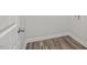 Empty laundry room with wood-look flooring at 3860 Well Fleet Drive, Fuquay Varina, NC 27526