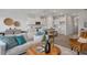 Bright living room seamlessly connecting with the modern kitchen, creating an open-concept design at 3860 Well Fleet Drive, Fuquay Varina, NC 27526