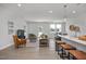 Open-concept living space blending seamlessly with kitchen and dining area, perfect for modern living at 3860 Well Fleet Drive, Fuquay Varina, NC 27526