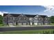 Charming new construction townhomes with gray siding, stone accents, and individual driveways at 3860 Well Fleet Drive, Fuquay Varina, NC 27526