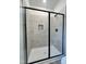 Modern bathroom featuring a glass-enclosed shower with sleek, black fixtures at 394 Maidenhair Pl, Clayton, NC 27520