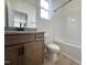 This bathroom features tile floors, wood cabinetry, granite countertop, toilet, tub and shower at 394 Maidenhair Pl, Clayton, NC 27520