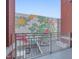 Balcony view of a colorful mural and parking, with a brick-lined exterior at 400 W North St # 620, Raleigh, NC 27603