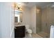 Bathroom featuring a glass shower enclosure, modern fixtures, and a neutral color scheme at 400 W North St # 620, Raleigh, NC 27603