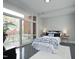 Serene bedroom with natural light, soft colors, and a beautiful mural beyond the balcony at 400 W North St # 620, Raleigh, NC 27603