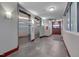 Hallway with elevators, TV, and modern finishes at 400 W North St # 620, Raleigh, NC 27603