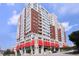 Stately high-rise with red awnings, brick accents, and a clear blue sky backdrop at 400 W North St # 620, Raleigh, NC 27603