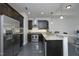 Well-equipped kitchen featuring stainless steel appliances, dark wood cabinets, and granite counters at 400 W North St # 620, Raleigh, NC 27603
