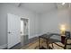 Office space with an open door leading to the bathroom and a black desk at 400 W North St # 620, Raleigh, NC 27603