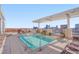 Relaxing rooftop pool area with lounge chairs and stunning city skyline views at 400 W North St # 620, Raleigh, NC 27603