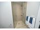 Shower with tiled walls, glass door, and modern shower head at 400 W North St # 620, Raleigh, NC 27603