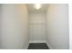 Empty walk-in closet with white walls and metal shelving for ample storage space at 400 W North St # 620, Raleigh, NC 27603