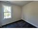 Minimal bedroom with carpet floors, and natural light from the window at 406 Maidenhair Pl, Clayton, NC 27520