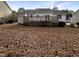 Home's back featuring a deck and yard at 4109 Mangrove Dr, Raleigh, NC 27616