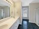 Bathroom with double vanity,tiled floor and shower at 4109 Mangrove Dr, Raleigh, NC 27616