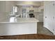 Kitchen with white cabinets, a breakfast bar, and stainless steel appliances at 4109 Mangrove Dr, Raleigh, NC 27616