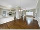 Kitchen and living area with hardwood floors and island at 4109 Mangrove Dr, Raleigh, NC 27616