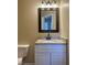 Bathroom featuring a vanity sink with granite countertop and cabinet at 412 N Cooper St, Clayton, NC 27520
