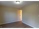 Simple bedroom with hardwood floors and access to bathroom at 412 N Cooper St, Clayton, NC 27520