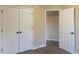 Bright bedroom with double doors leading to another room at 412 N Cooper St, Clayton, NC 27520