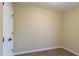 Bedroom with warm colored walls and new hard wood floors at 412 N Cooper St, Clayton, NC 27520