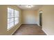 Simple dining area with hardwood floors and large window at 412 N Cooper St, Clayton, NC 27520