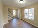 Bright living room with hardwood floors and large windows at 412 N Cooper St, Clayton, NC 27520