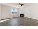 Bright living room featuring a fireplace and large window at 423 Blue Aspen Dr, Fuquay Varina, NC 27526