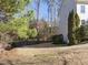 Spacious backyard with mature trees and wood chips at 424 Waverly Hills Dr, Cary, NC 27519