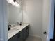 Bathroom features double sinks, modern fixtures, and a large mirror at 4318 Emeline Ln # 20, Fuquay Varina, NC 27526
