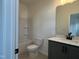 Bathroom showing the toilet, sink with a white countertop, and shower-tub combo at 4318 Emeline Ln # 20, Fuquay Varina, NC 27526