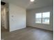 Bedroom featuring hardwood floors and a large window at 4318 Emeline Ln # 20, Fuquay Varina, NC 27526