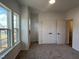 Bedroom with neutral carpet, double closets, and three large windows at 4318 Emeline Ln # 20, Fuquay Varina, NC 27526